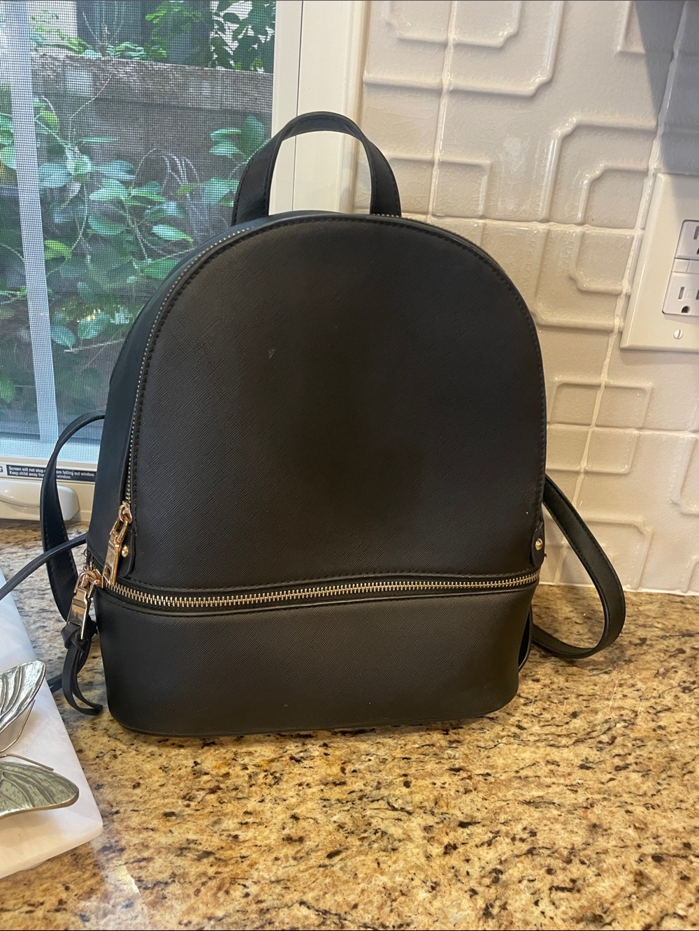 Minimalist Black Backpack with Gold Zipper Detail